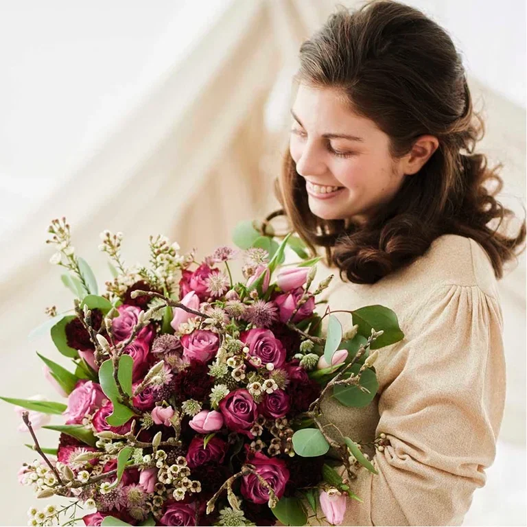 Feir mamma med blomster på morsdagen 