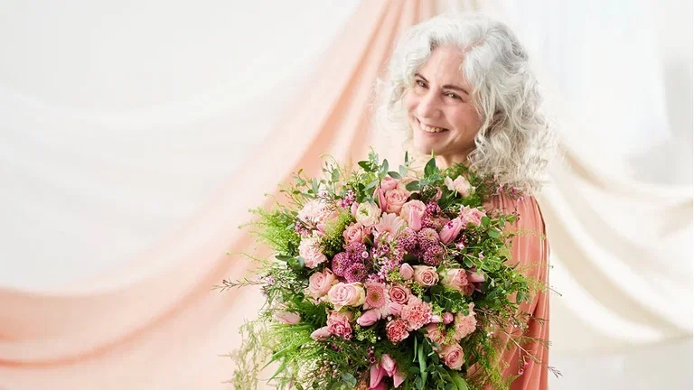 Feir mamma med blomster på morsdagen 